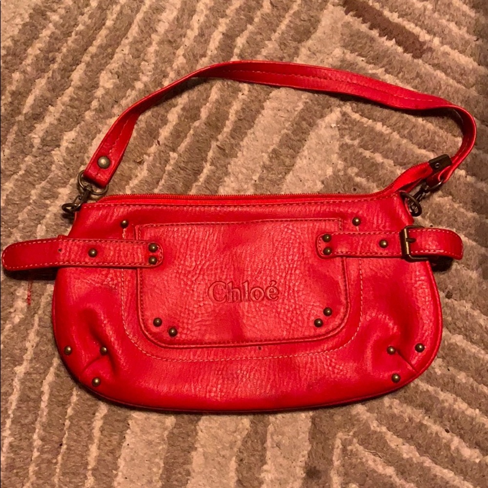Small Chloé brand clutch. Leather w/ suede inside